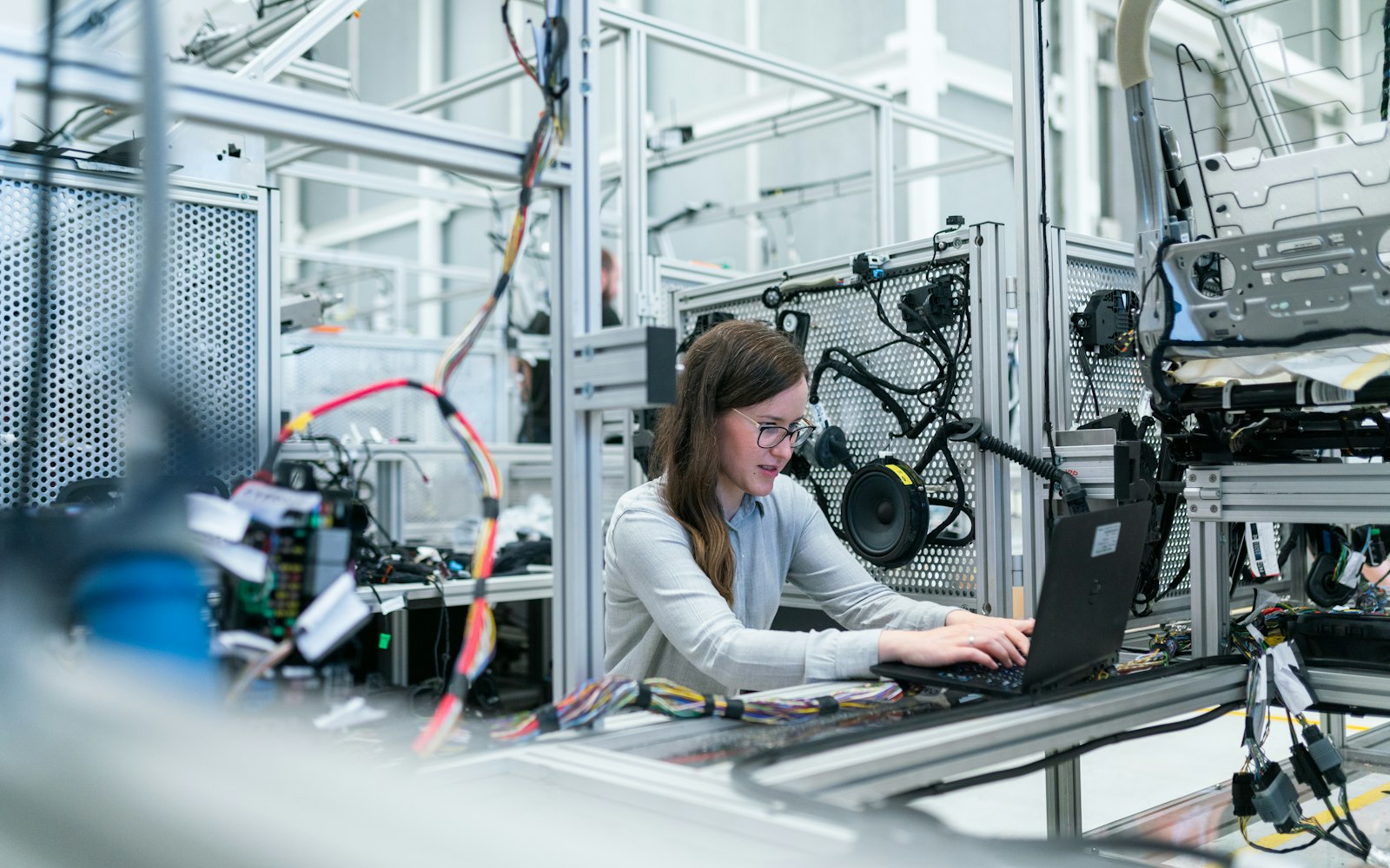 OT security engineer commissioning industrial control equipment on the plant floor